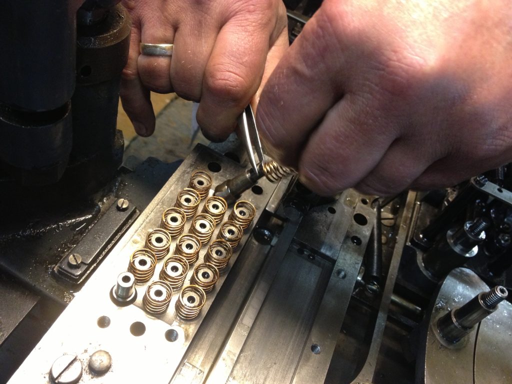 John demonstrating removal of air pistons, for when they clog up with paper roll chads.