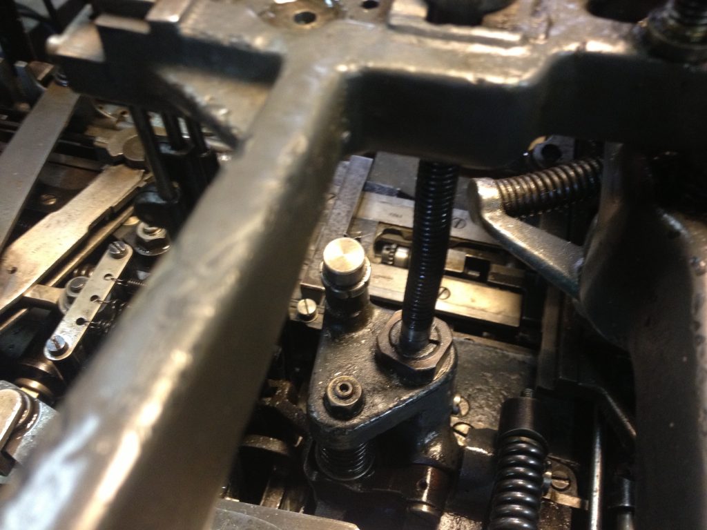 In the middle is the fine adjuster, lower on the machine and behind/right in this picture is the more coarse adjustment screw